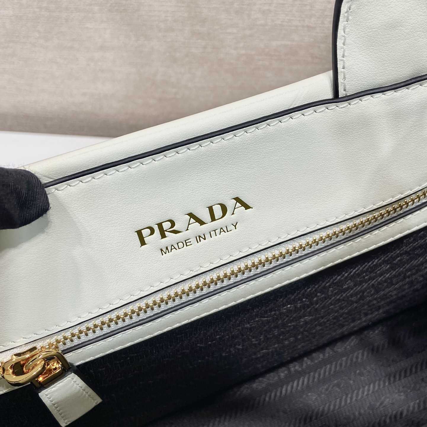 Prada Small Leather Prada Symbole Bag With Topstitching - DesignerGu