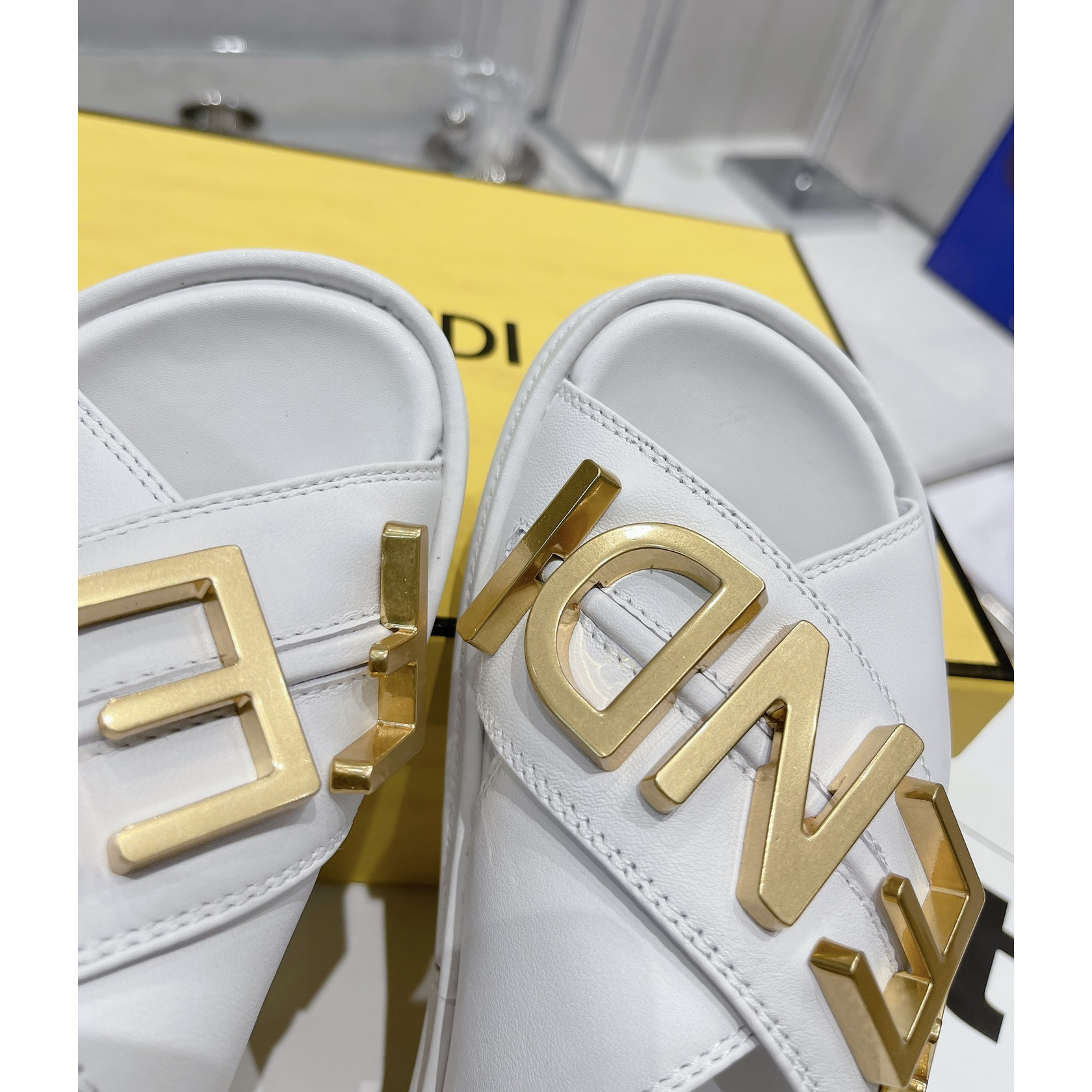 Fendi Graphy White Leather Slides - DesignerGu