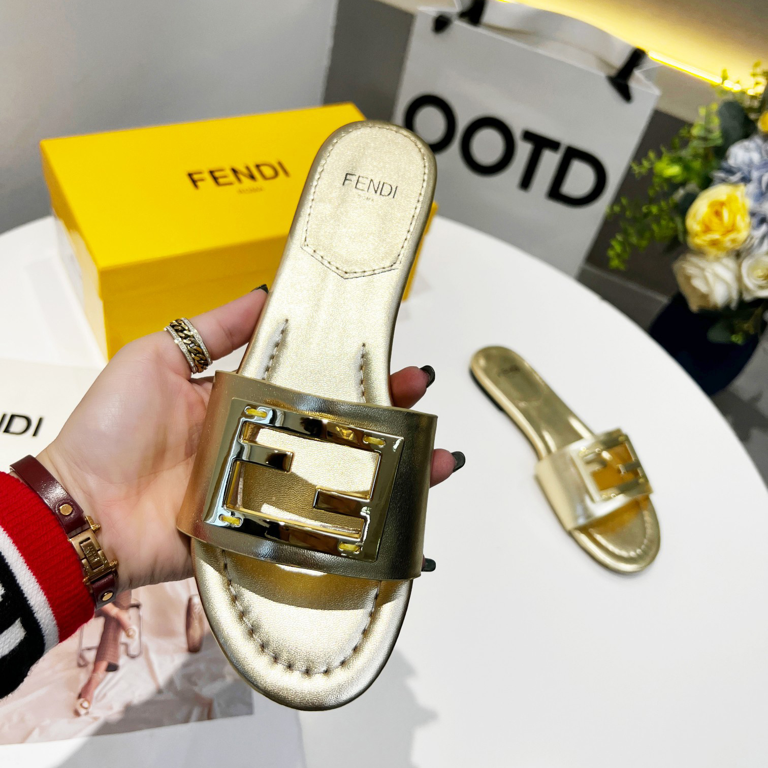 Fendi Baguette Gold nappa leather slides - DesignerGu