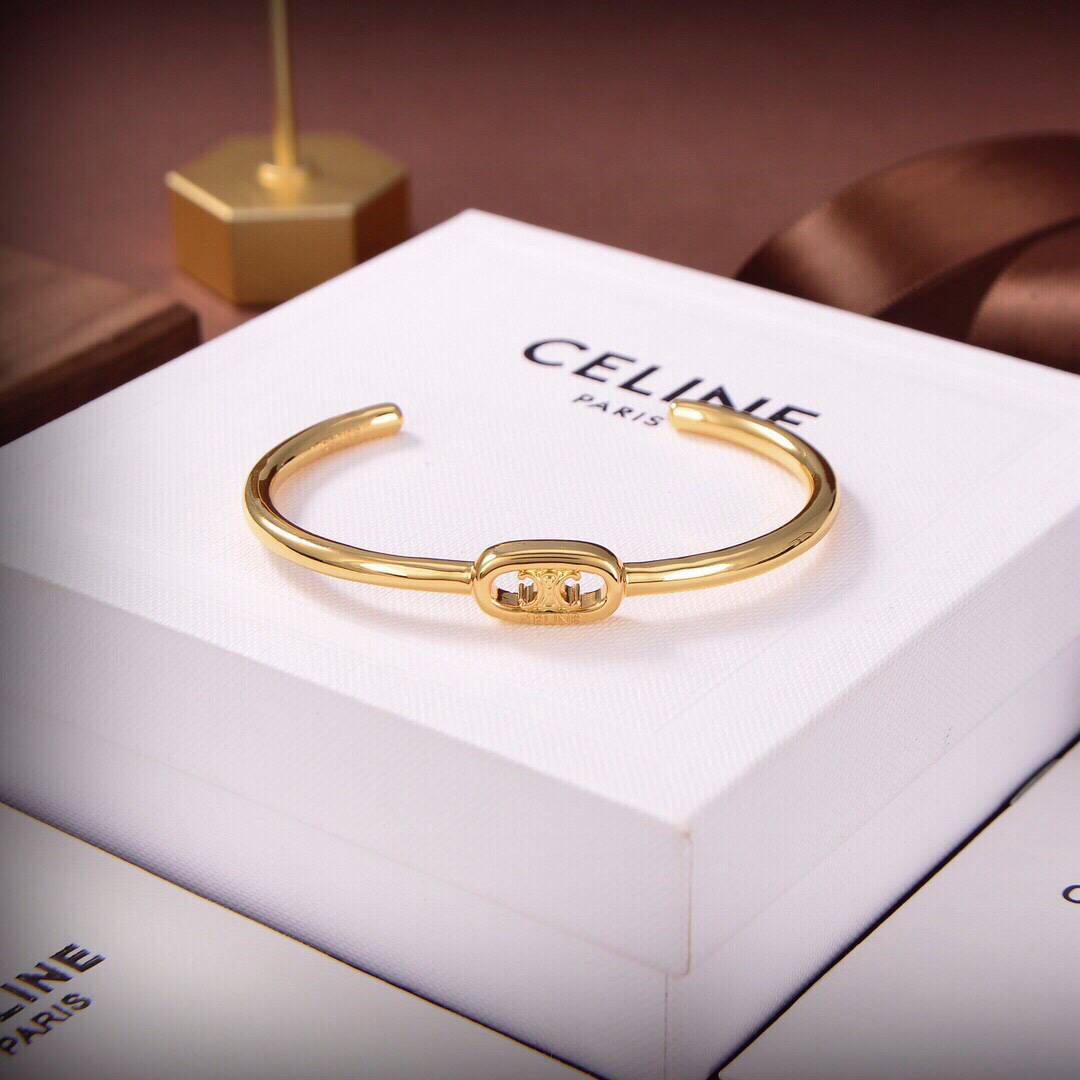 Celine Maillon Triomphe Thin Cuff In Brass With Gold Finish - DesignerGu