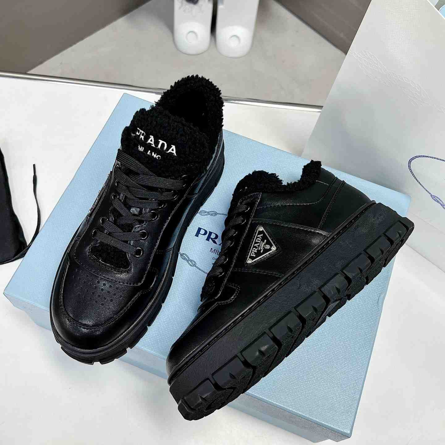 Prada Leather And Shearling Sneakers - DesignerGu