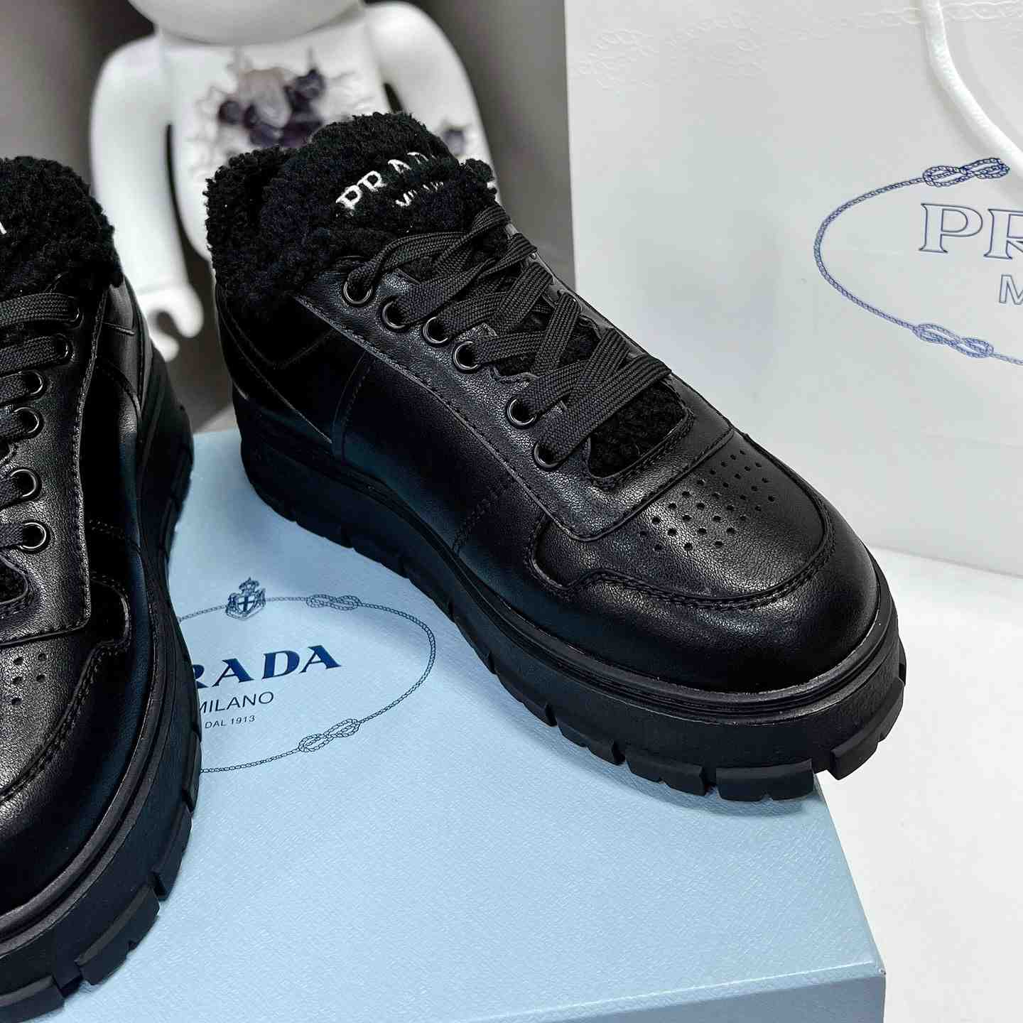 Prada Leather And Shearling Sneakers - DesignerGu