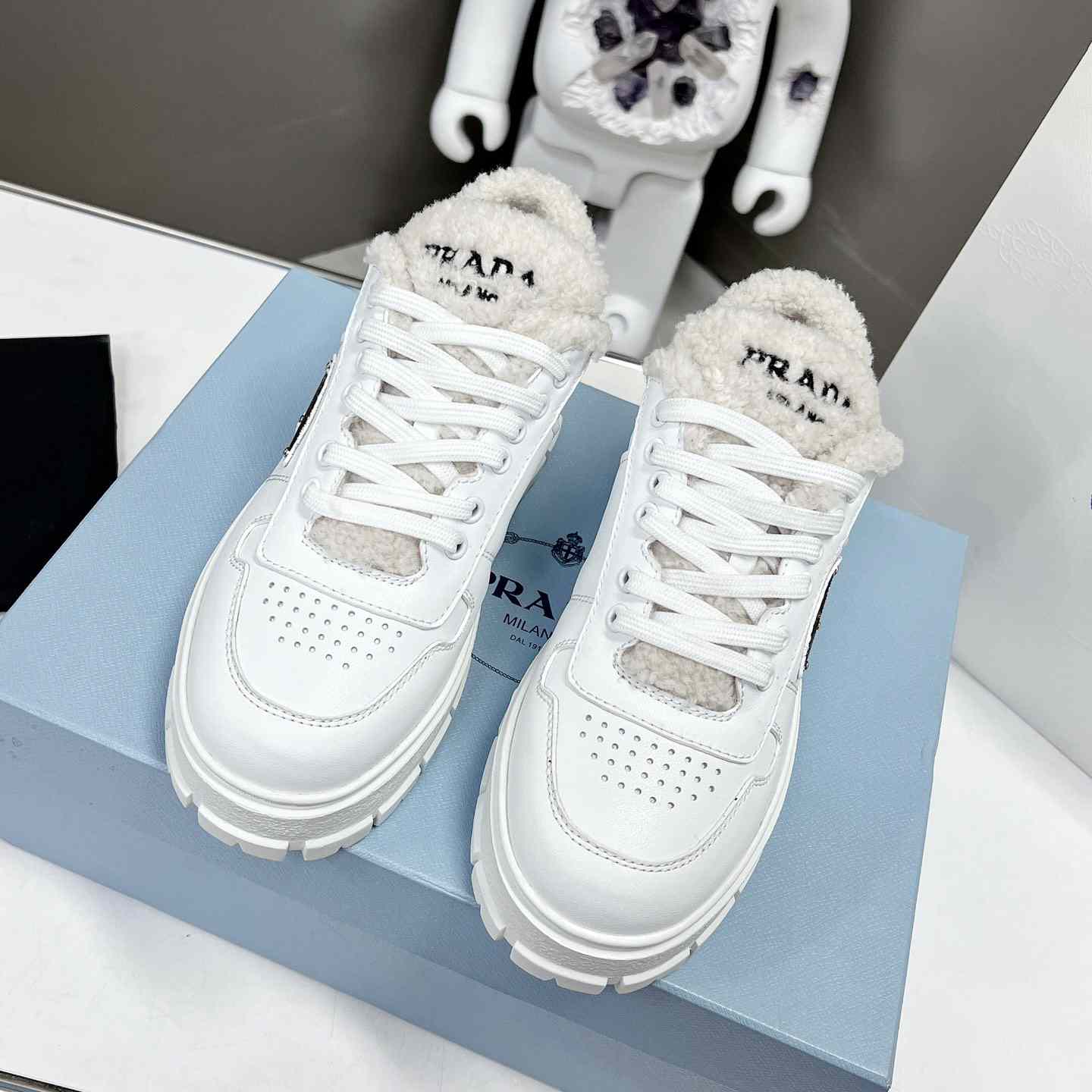 Prada Leather And Shearling Sneakers - DesignerGu