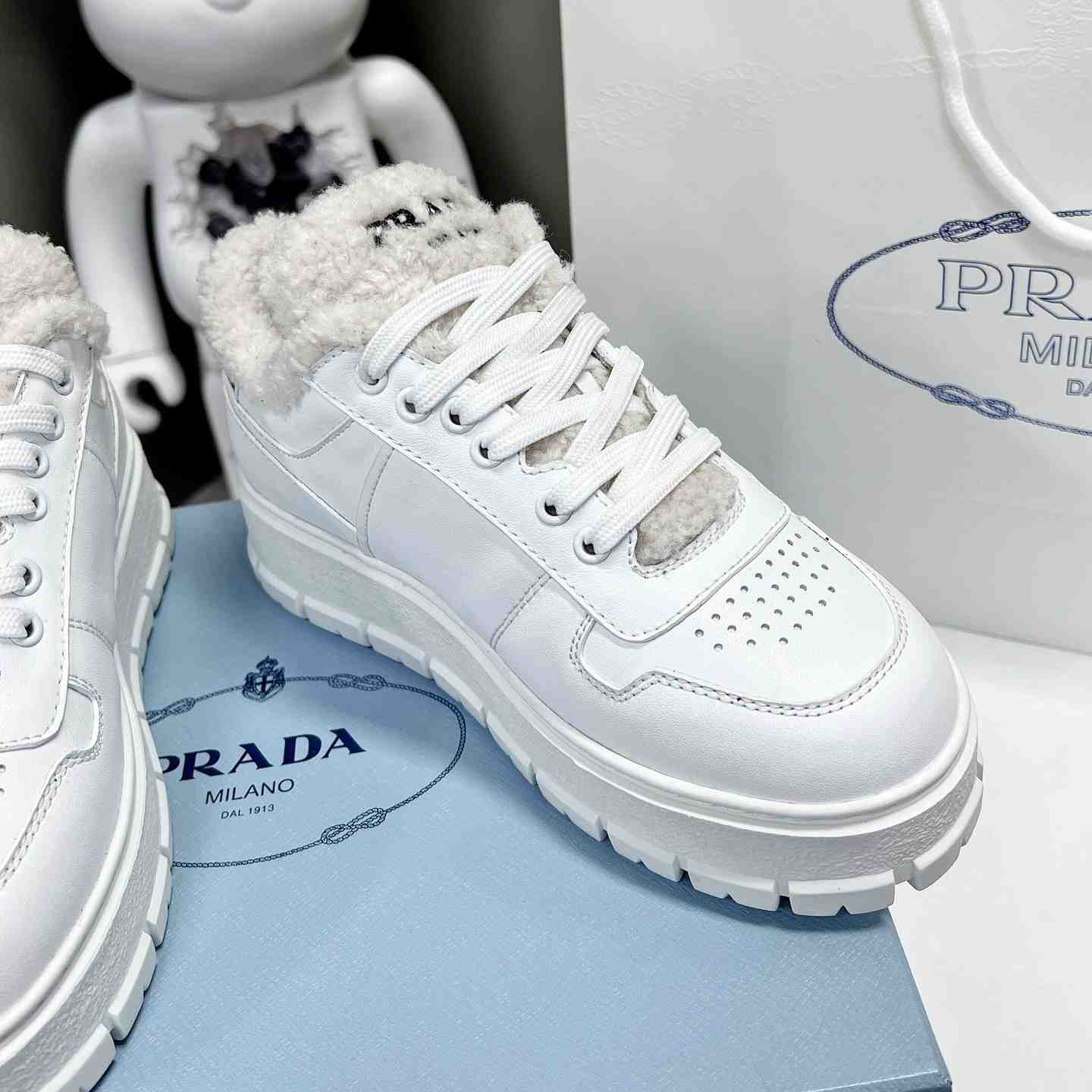 Prada Leather And Shearling Sneakers - DesignerGu