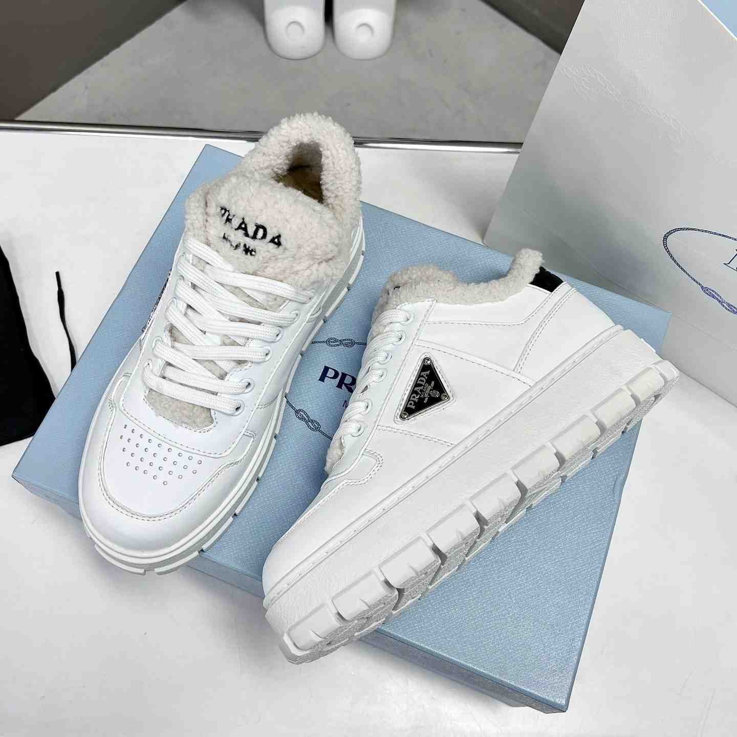 Prada Leather And Shearling Sneakers - DesignerGu