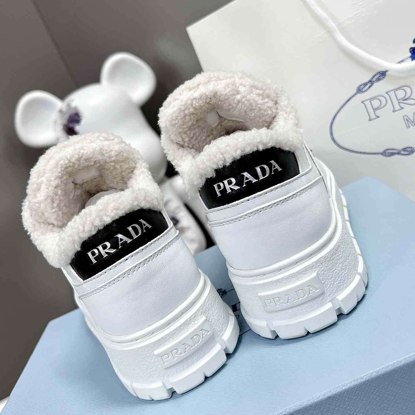 Prada Leather And Shearling Sneakers - DesignerGu