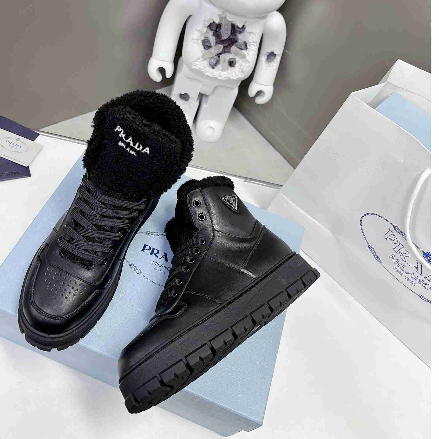 Prada Leather And Shearling High-top Sneakers - DesignerGu