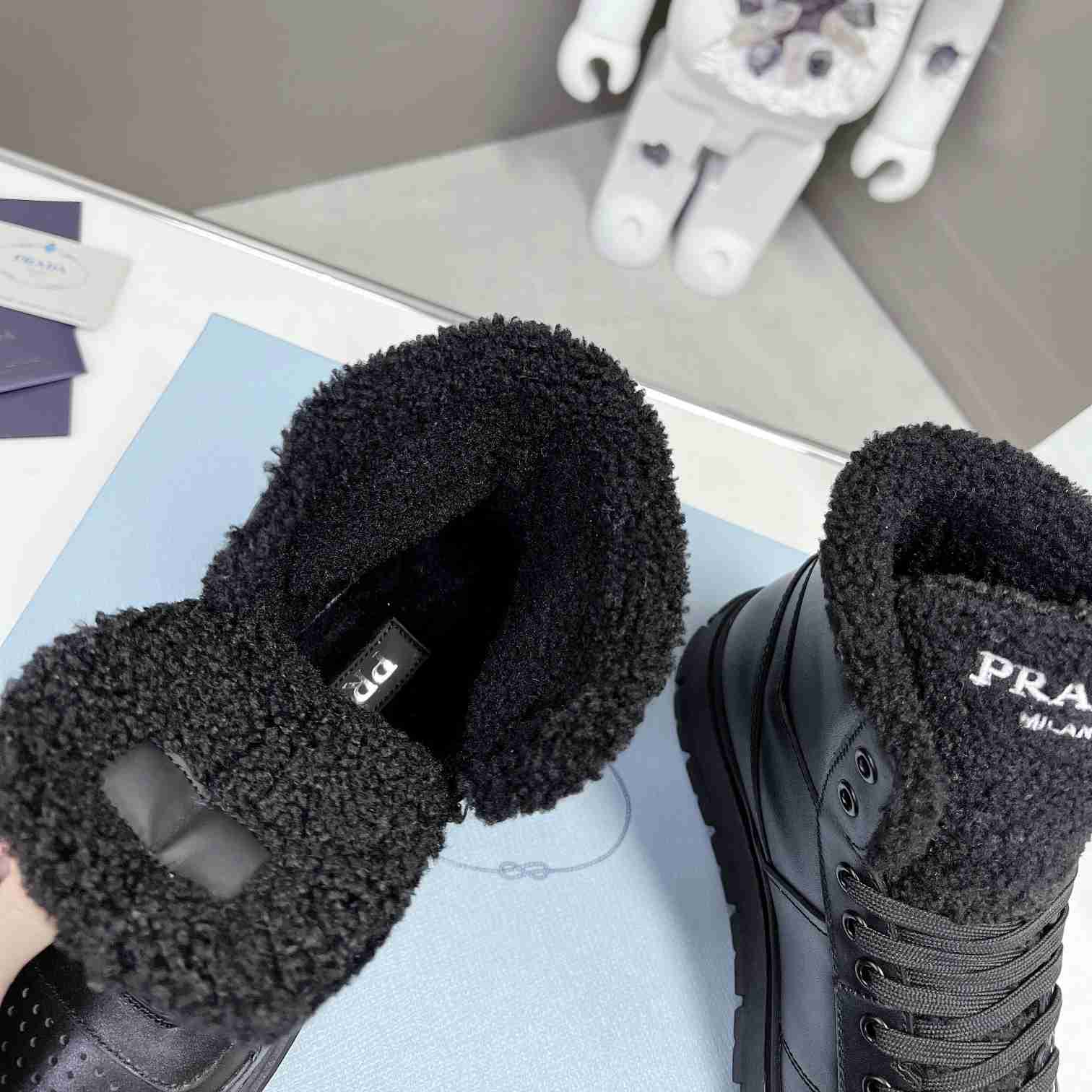 Prada Leather And Shearling High-top Sneakers - DesignerGu