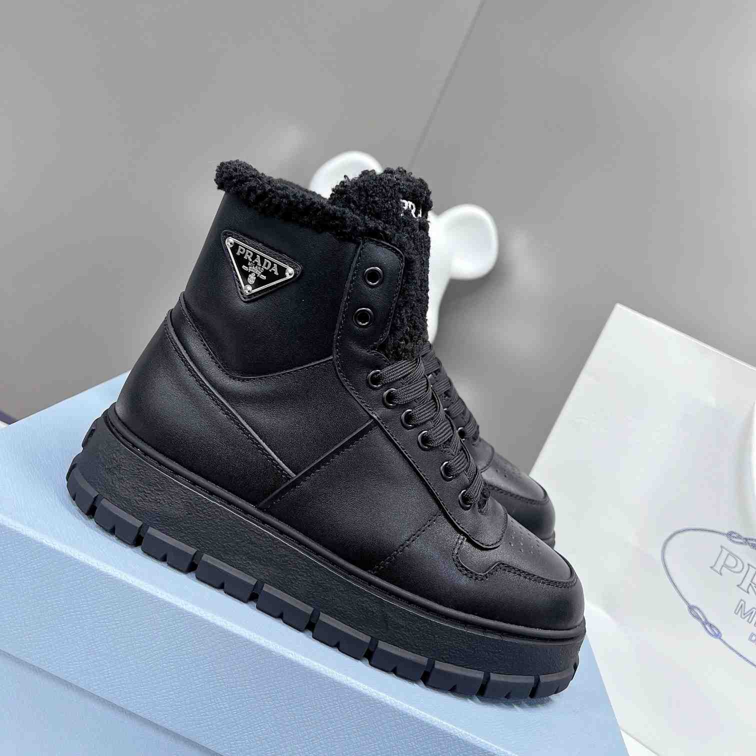 Prada Leather And Shearling High-top Sneakers - DesignerGu