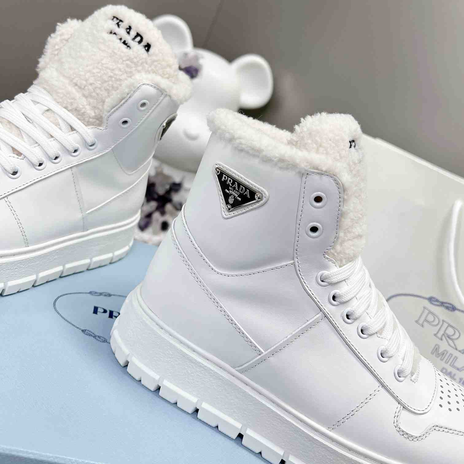 Prada Leather And Shearling High-top Sneakers - DesignerGu