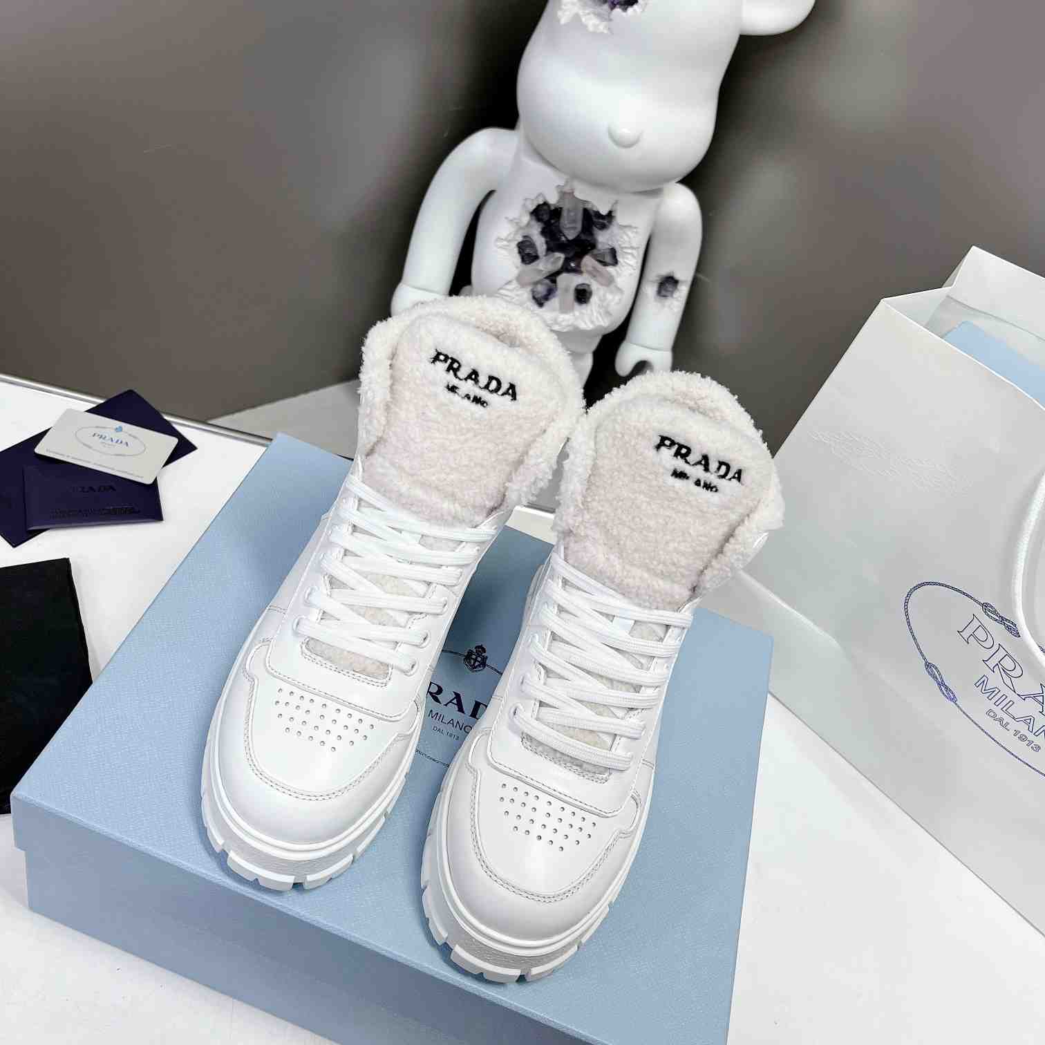 Prada Leather And Shearling High-top Sneakers - DesignerGu