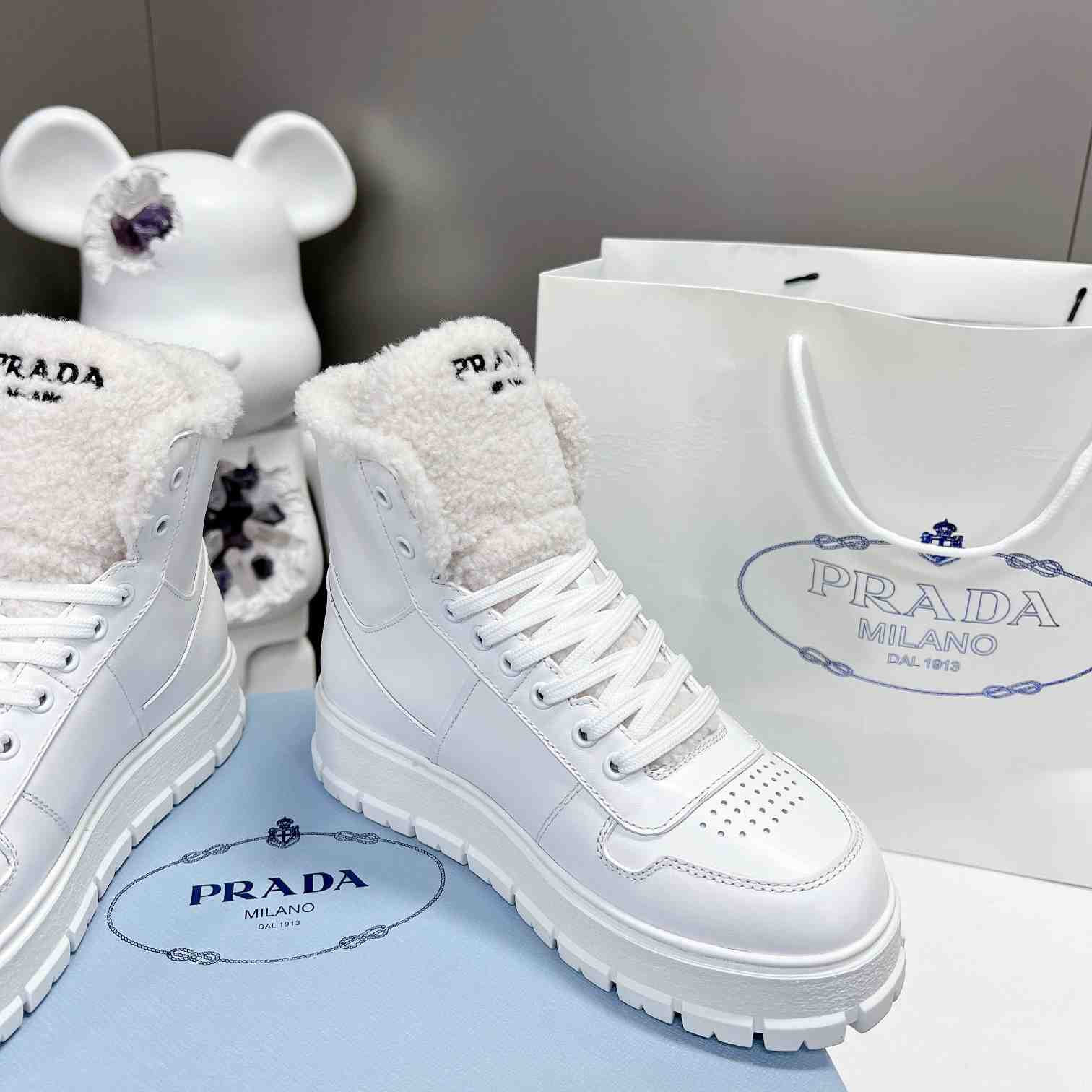 Prada Leather And Shearling High-top Sneakers - DesignerGu