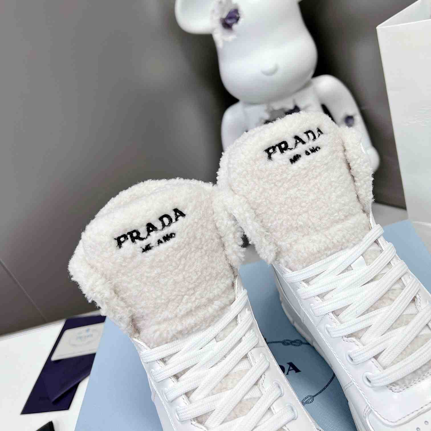 Prada Leather And Shearling High-top Sneakers - DesignerGu