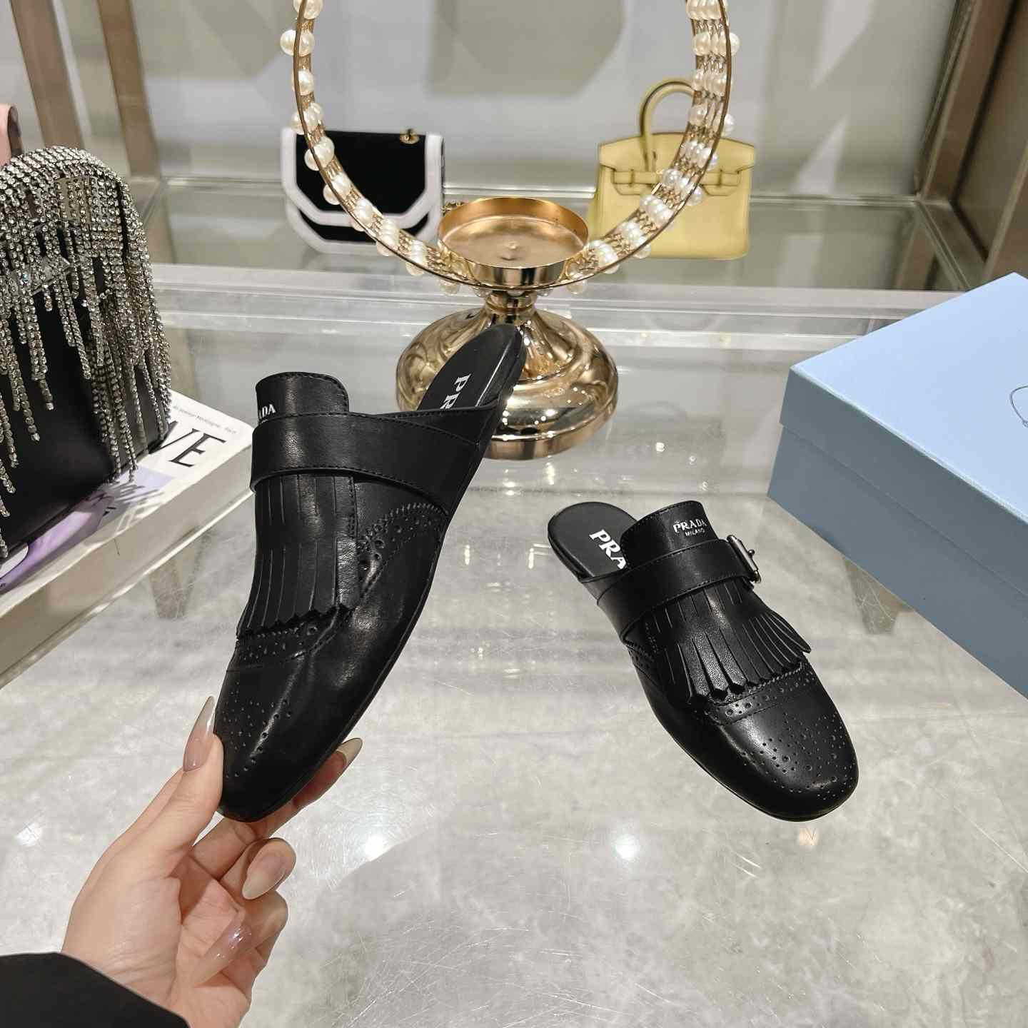 Prada Shuffle Fringed Monk Strap Leather Mules - DesignerGu