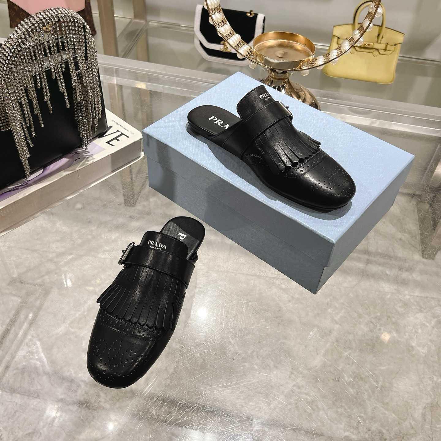 Prada Shuffle Fringed Monk Strap Leather Mules - DesignerGu