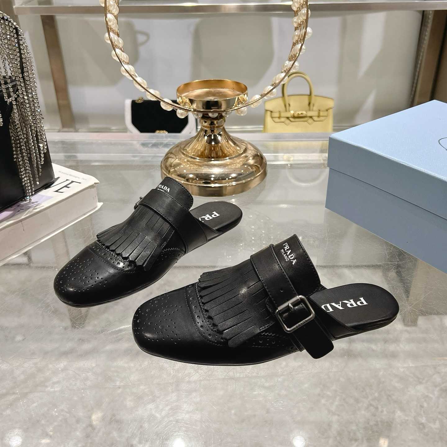 Prada Shuffle Fringed Monk Strap Leather Mules - DesignerGu